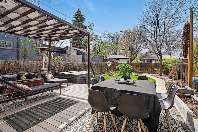 deck with a fenced backyard, a pergola, a covered hot tub, and outdoor dining space
