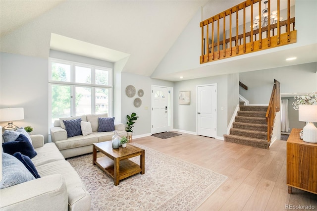 16438 E Prentice Cir, Centennial, CO 80015 - living room featuring wood finished floors, high vaulted ceiling, stairway, and recessed lighting