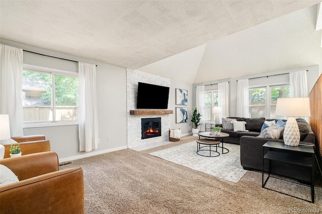 16438 E Prentice Cir, Centennial, CO 80015 - carpeted living room featuring a textured ceiling, a fireplace, and vaulted ceiling