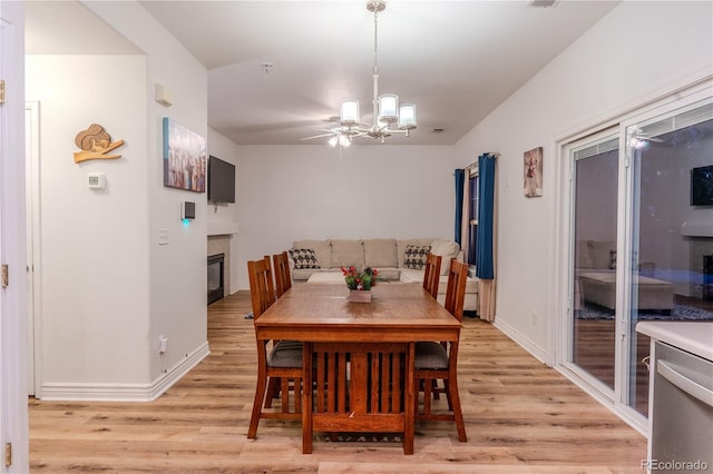 dining room featuring a chandelier and light hardwood / wood-style floors