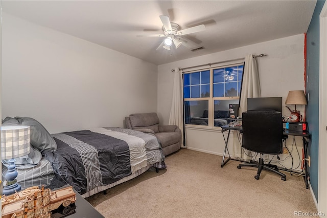 bedroom with ceiling fan and carpet floors