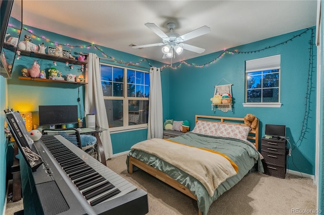 carpeted bedroom with ceiling fan