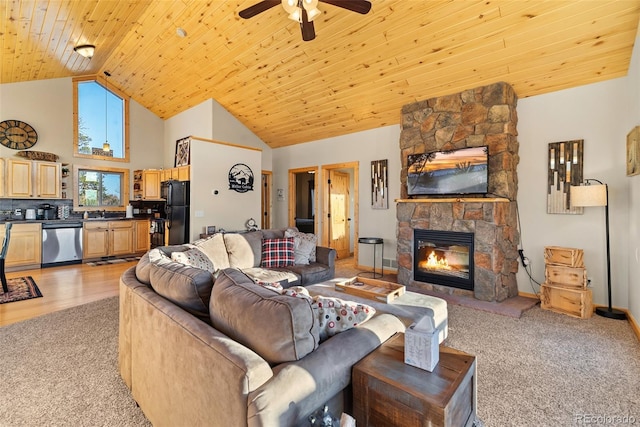 270 Piaute Way, Como, CO 80432 - living room featuring light carpet, ceiling fan, high vaulted ceiling, a fireplace, and wood ceiling