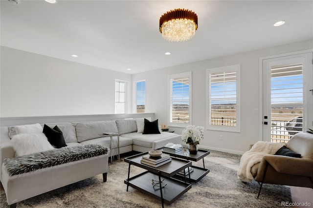 living room featuring recessed lighting, carpet, and baseboards