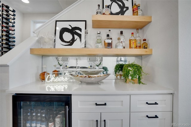 bar with beverage cooler and a bar