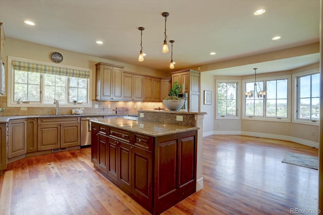 14993 W 55th Dr, Golden, CO 80403 - kitchen with a sink, healthy amount of natural light, dishwasher, light wood-type flooring, and recessed lighting