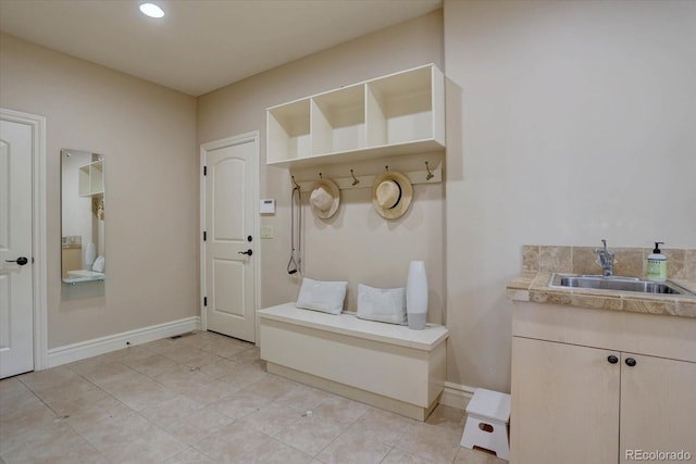 14993 W 55th Dr, Golden, CO 80403 - mudroom featuring a sink, light tile patterned floors, baseboards, and recessed lighting