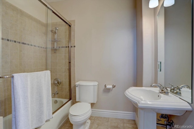 14993 W 55th Dr, Golden, CO 80403 - bathroom featuring tile patterned flooring, toilet, combined bath / shower with glass door, and baseboards