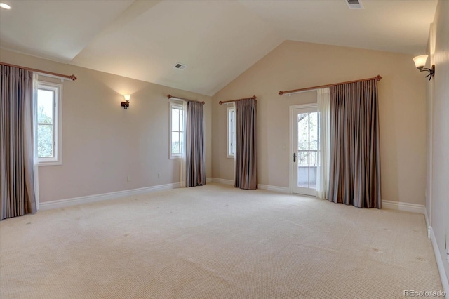 14993 W 55th Dr, Golden, CO 80403 - empty room with lofted ceiling, light carpet, plenty of natural light, and baseboards