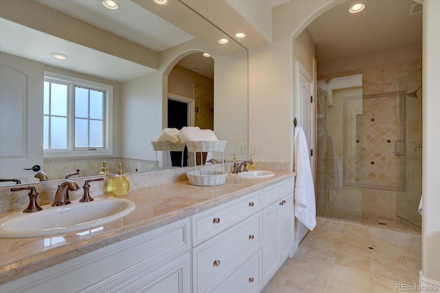 14993 W 55th Dr, Golden, CO 80403 - bathroom with double vanity, a stall shower, recessed lighting, and tile patterned flooring