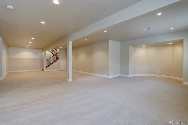 14993 W 55th Dr, Golden, CO 80403 - finished basement with light colored carpet, recessed lighting, stairs, and baseboards