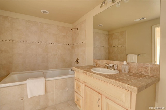 14993 W 55th Dr, Golden, CO 80403 - bathroom with vanity, tiled shower / bath, and tile patterned floors