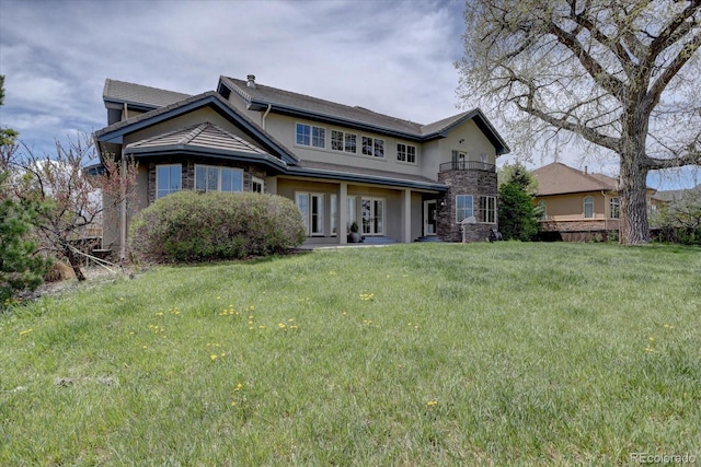 14993 W 55th Dr, Golden, CO 80403 - back of house with a yard and stucco siding