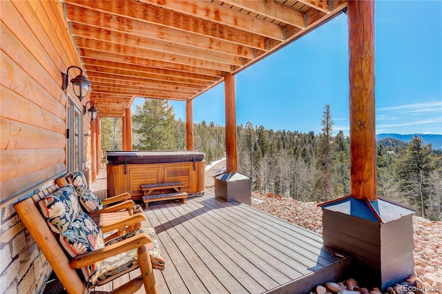 11450 Marks Dr, Conifer, CO 80433 - deck with a hot tub, a forest view, and a mountain view