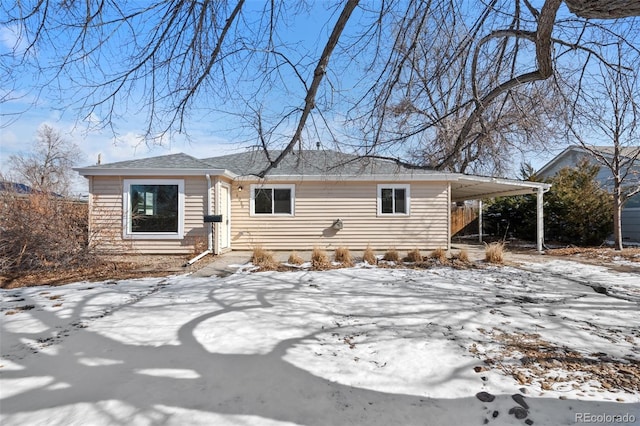 view of front of property with a carport