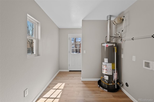 utility room with gas water heater