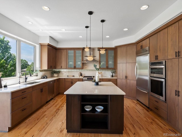 10057 S Shadow Hill Dr, Lone Tree, CO 80124 - kitchen with appliances with stainless steel finishes, wall chimney exhaust hood, open shelves, a sink, and tasteful backsplash