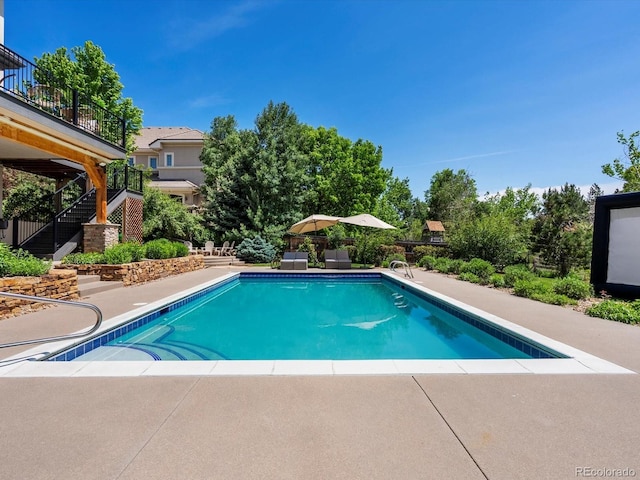 10057 S Shadow Hill Dr, Lone Tree, CO 80124 - swimming pool with stairway and a patio area