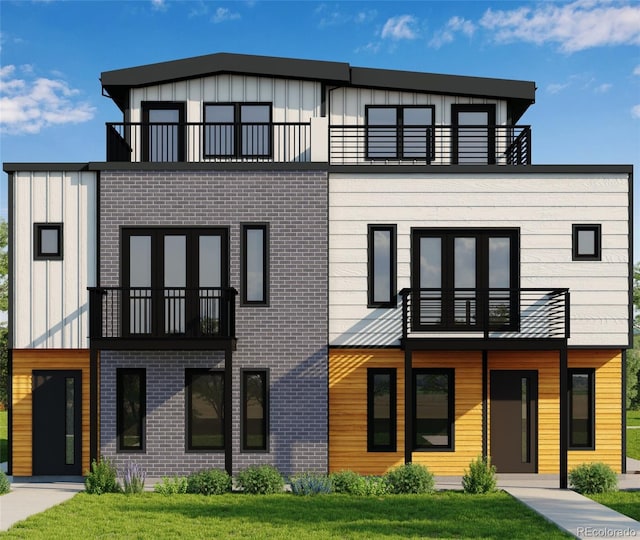 3512 Wyandot St, Denver, CO 80211 - view of front facade featuring a balcony, board and batten siding, a front yard, and brick siding