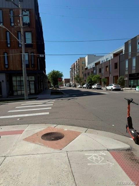 3512 Wyandot St, Denver, CO 80211 - view of asphalt road with sidewalks, curbs, traffic signs, and street lighting