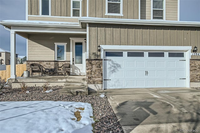 doorway to property with a garage