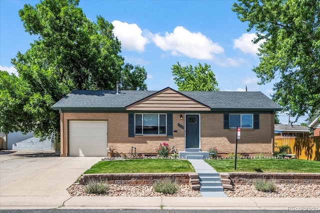 2069 E 116th Ave, Northglenn, CO 80233 - single story home with an attached garage, driveway, brick siding, and a shingled roof