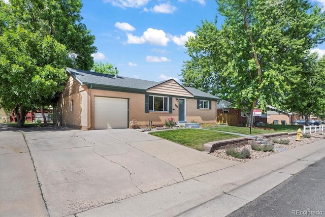 2069 E 116th Ave, Northglenn, CO 80233 - ranch-style house with an attached garage, driveway, and a front lawn