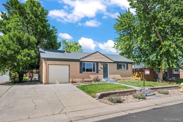 2069 E 116th Ave, Northglenn, CO 80233 - ranch-style home with concrete driveway, a garage, and brick siding