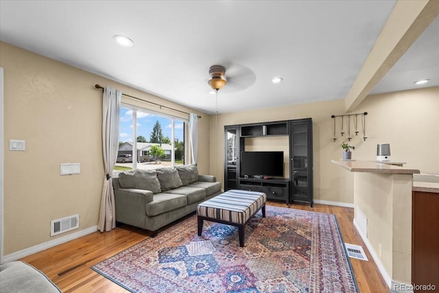 2069 E 116th Ave, Northglenn, CO 80233 - living area featuring wood finished floors, a ceiling fan, and recessed lighting