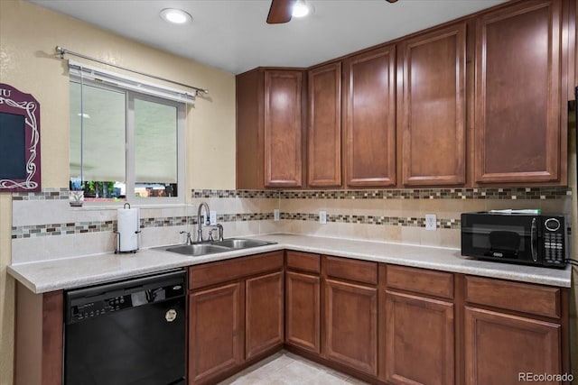 2069 E 116th Ave, Northglenn, CO 80233 - kitchen with black appliances, tasteful backsplash, light countertops, and brown cabinets