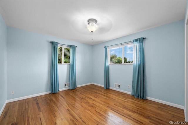 2069 E 116th Ave, Northglenn, CO 80233 - unfurnished room with plenty of natural light, wood finished floors, and ceiling fan