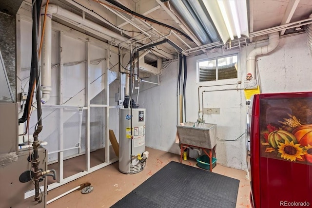 2069 E 116th Ave, Northglenn, CO 80233 - unfinished below grade area featuring water heater and washer / dryer