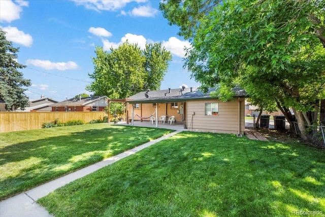 2069 E 116th Ave, Northglenn, CO 80233 - rear view of house featuring a patio area and a fenced backyard