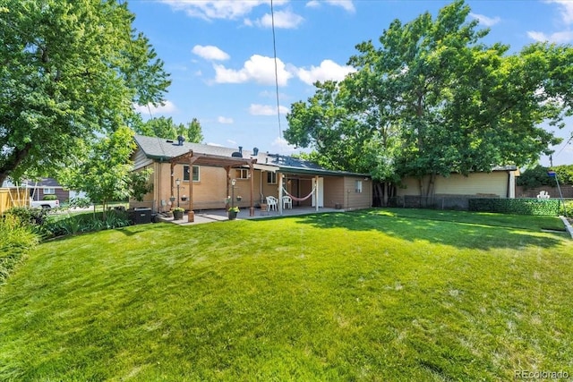2069 E 116th Ave, Northglenn, CO 80233 - back of property featuring a patio area