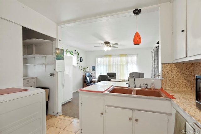 2732 W Archer Pl, Denver, CO 80219 - kitchen featuring tasteful backsplash, white cabinetry, light countertops, a peninsula, and a ceiling fan