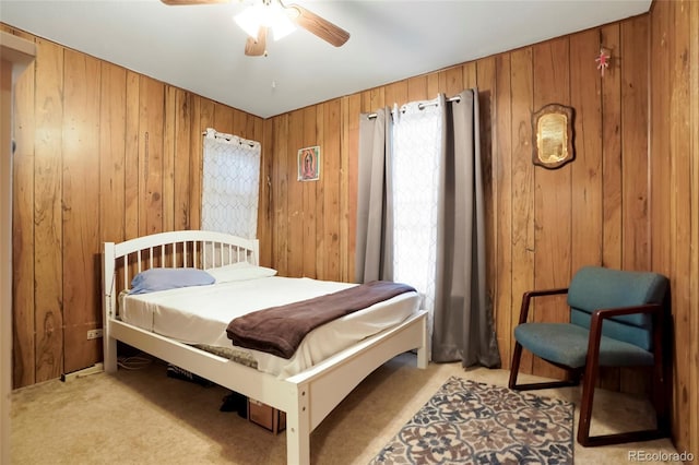 2732 W Archer Pl, Denver, CO 80219 - bedroom with light carpet, wooden walls, and ceiling fan