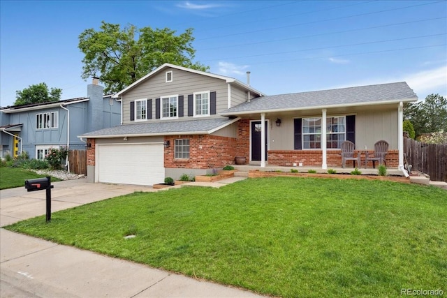 11021 Otis St, Westminster, CO 80020 - tri-level home with brick siding, driveway, covered porch, and a garage