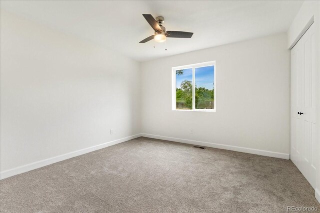11021 Otis St, Westminster, CO 80020 - carpeted spare room with a ceiling fan and baseboards