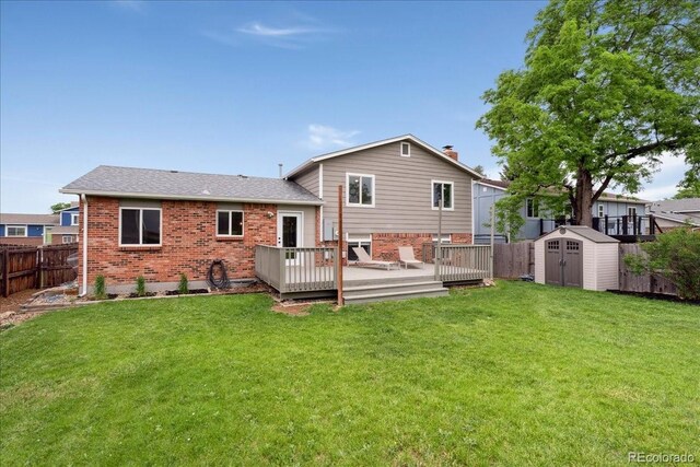 11021 Otis St, Westminster, CO 80020 - back of house with brick siding, a wooden deck, and roof with shingles