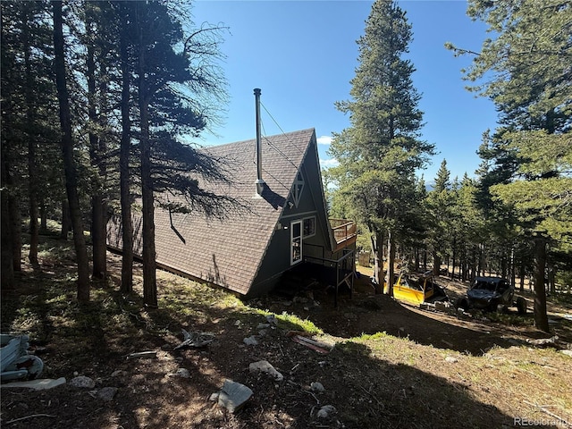 274 Lincoln Dr, Idaho Springs, CO 80452 - view of side of home featuring a shingled roof