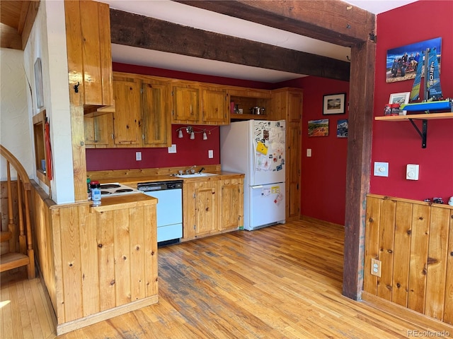274 Lincoln Dr, Idaho Springs, CO 80452 - kitchen with dishwashing machine, freestanding refrigerator, light wood-style flooring, light countertops, and beamed ceiling