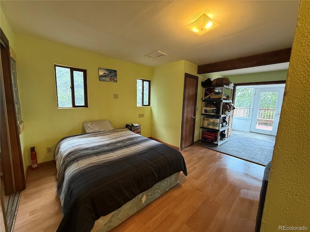 274 Lincoln Dr, Idaho Springs, CO 80452 - bedroom featuring light wood-type flooring and access to exterior