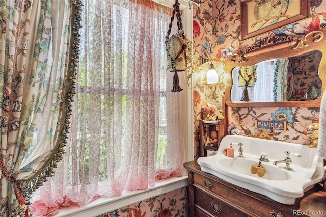 2324 S Columbine St, Denver, CO 80210 - full bathroom with wallpapered walls, vanity, and washtub / shower combination