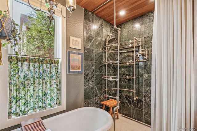 2324 S Columbine St, Denver, CO 80210 - bathroom with a tile shower, a soaking tub, and tile walls