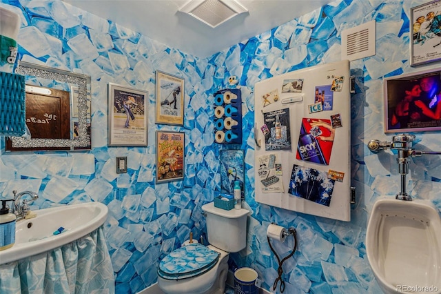 2324 S Columbine St, Denver, CO 80210 - half bath with tile walls, toilet, and a sink