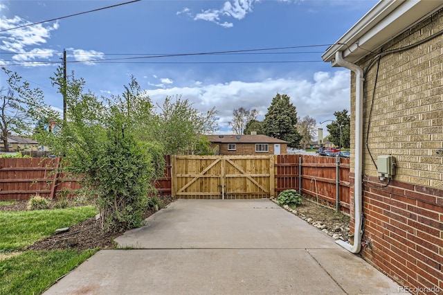 3600 Olive St, Denver, CO 80207 - view of patio featuring fence and a gate