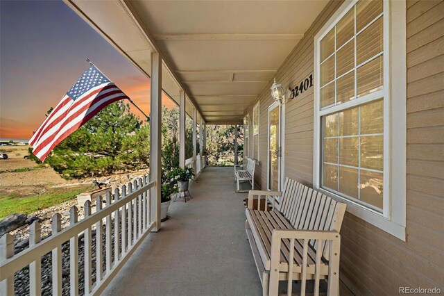 patio terrace at dusk with covered porch