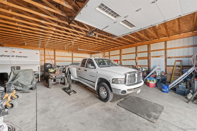 garage featuring visible vents and metal wall