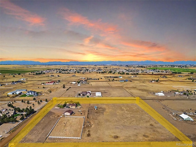 aerial view at dusk with a mountain view