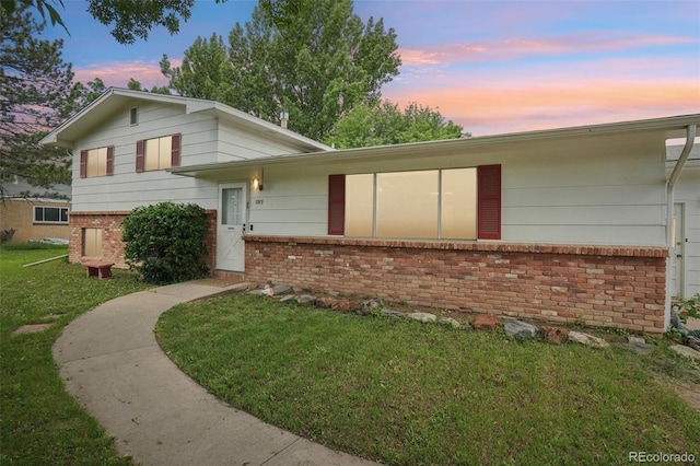 1213 S Taft Hill Rd, Fort Collins, CO 80521 - tri-level home featuring brick siding and a front lawn